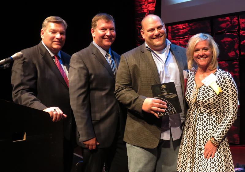 SoDel Concepts’ Senior Advisor Alan Levin, left, joins DRA Executive Director Steve “Monty” Montgomery and DRA President and CEO Carrie Leishman in presenting the Cornerstone Award to SoDel Concepts’ CEO Scott Kammerer. BOB YESBEK PHOTO